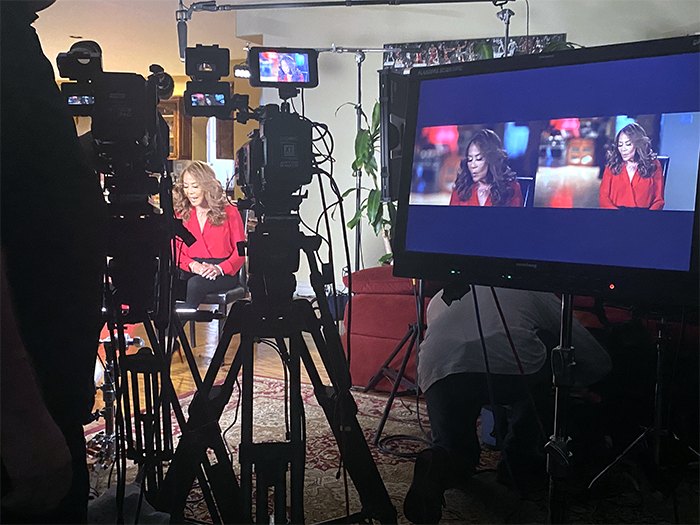 Interview production setup with cameras and monitor